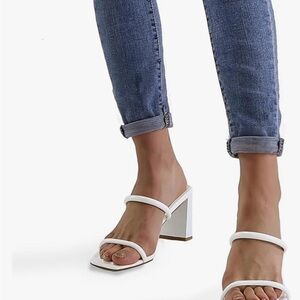 White three inch slip on dress shoes.